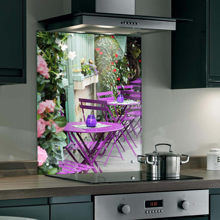 Vibrant Parisian terrace splashback with purple chairs and flowers, adding charm to any kitchen.