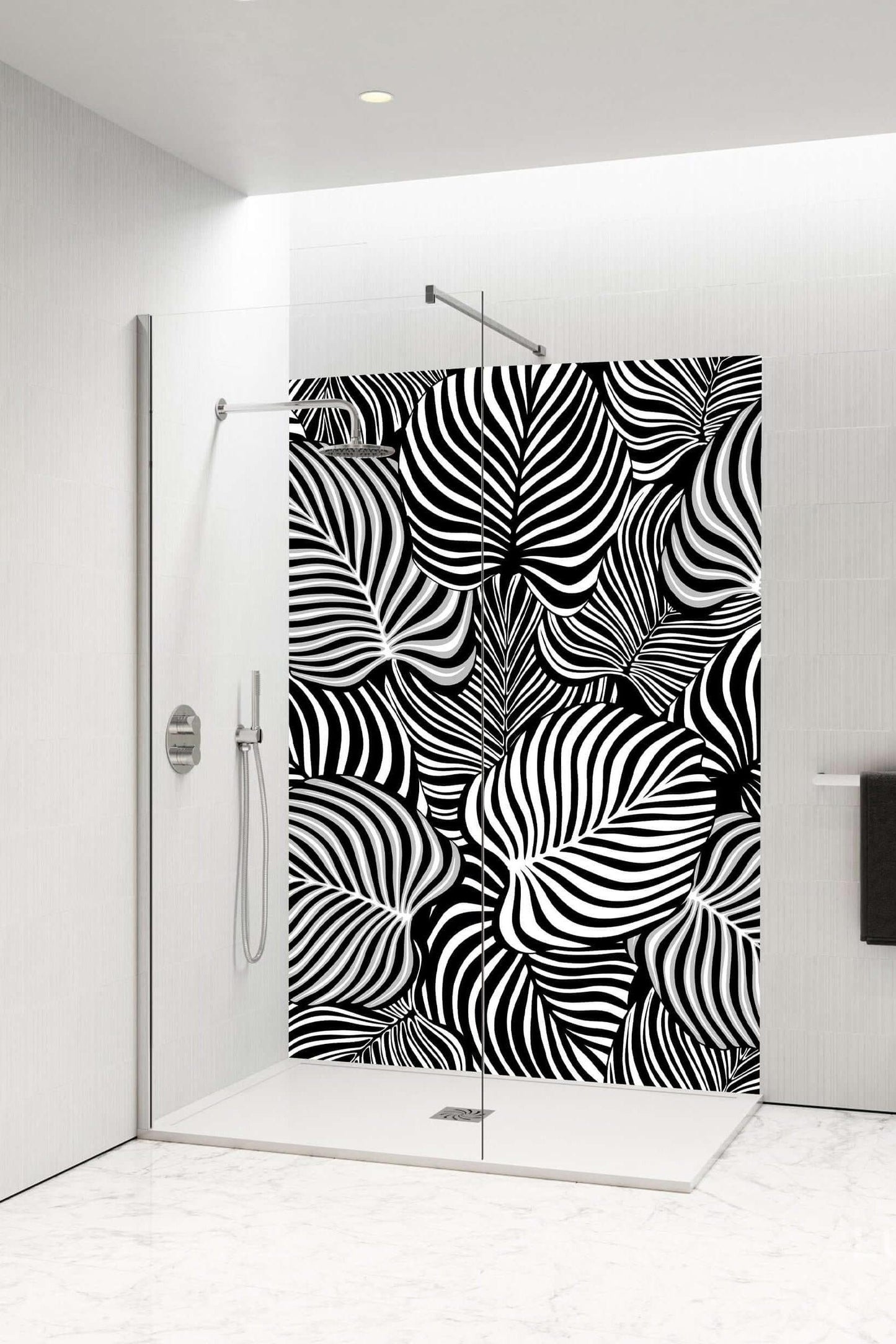 Black and white zebra-style shower panel with botanical leaf design, transforming bathroom into a modern retreat.
