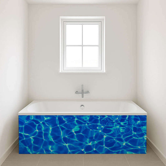 Stylish bathtub with blue water reflection design, creating a serene ambiance in a minimalist bathroom.