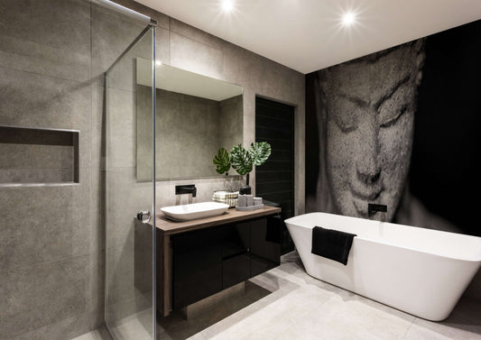 Elegant bathroom featuring a large Buddha face mural, creating a tranquil and sophisticated atmosphere.