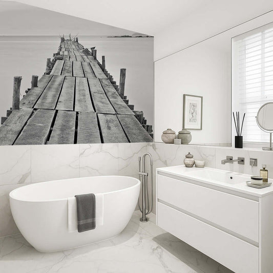 Bathroom art featuring a weathered jetty looking out to sea, enhancing a calm and relaxing atmosphere.