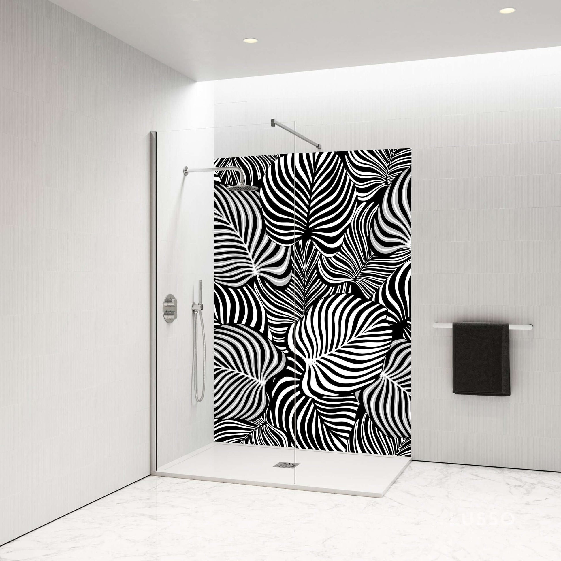 Elegant black and white swirl shower panel featuring dynamic leaf patterns in a modern bathroom setting.