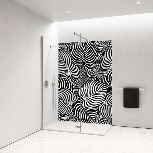 Elegant black and white swirl shower panel featuring dynamic leaf patterns in a modern bathroom setting.