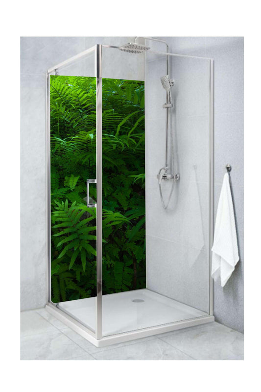 Close-up view of a shower panel featuring large green ferns, creating a calming, nature-inspired bathroom environment.