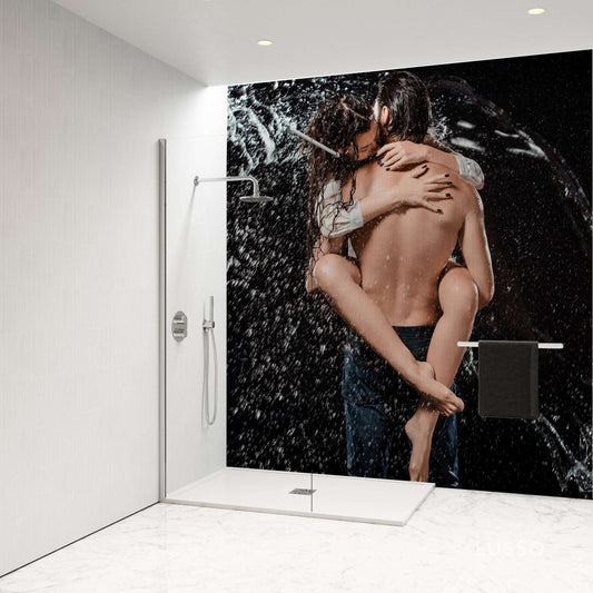 Couple embracing in a vibrant shower scene with water splashing, showcasing a stylish shower panel design.