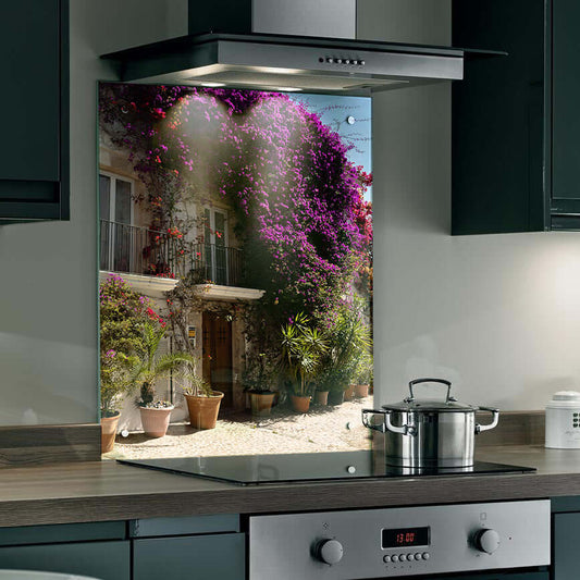 Sunlit villa kitchen splashback featuring blooming bougainvillaea and terracotta pots for rustic charm.