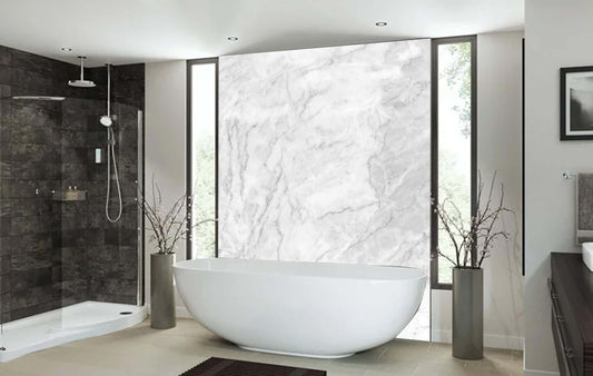 Luxurious bathroom featuring natural marble print panel, elegant bathtub, and stylish design elements.