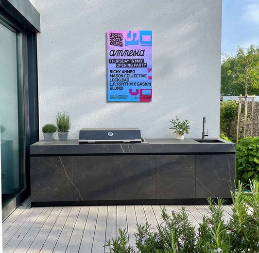 Amnesia Flyer on outdoor kitchen wall, promoting a vibrant party atmosphere inspired by Ibiza culture.
