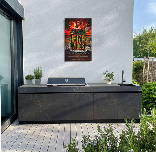 Ibiza Vibes garden art poster above modern outdoor kitchen, featuring tropical sunset and palm trees.