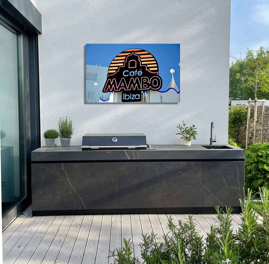 Café Mambo Ibiza artwork displayed above an outdoor kitchen, adding a touch of iconic beachside nightlife decor.