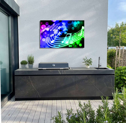 Vibrant musical artwork in garden setting, showcasing glowing notes and colorful hues on an outdoor wall.