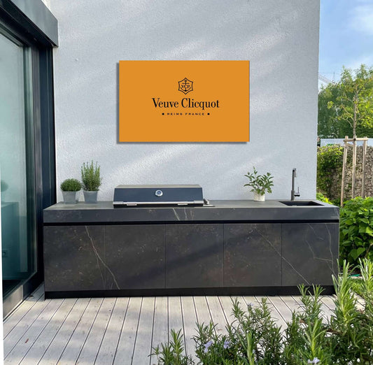 Elegant outdoor space featuring Veuve Clicquot artwork, adding luxury and sophistication to the garden.