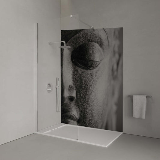 Close-up of a monochrome Buddha head shower panel, promoting Zen tranquility and mindfulness in bathroom decor.