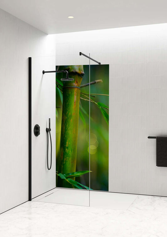 Verdant Rise Shower Panel by Opelli featuring a close-up of a bamboo stem and fresh greenery in a modern bathroom setting.