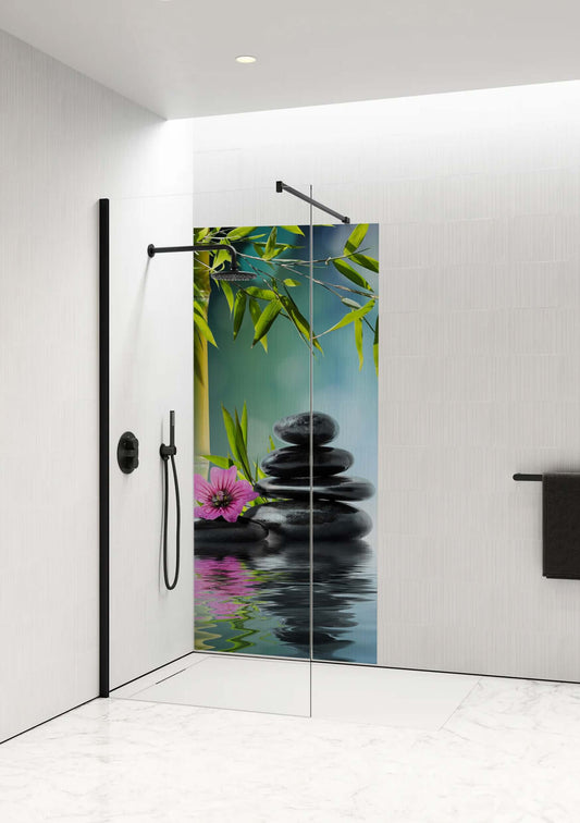 Oriental Bloom Shower Panel by Opelli featuring bamboo, smooth stones, and a pink flower for a serene bathroom atmosphere.