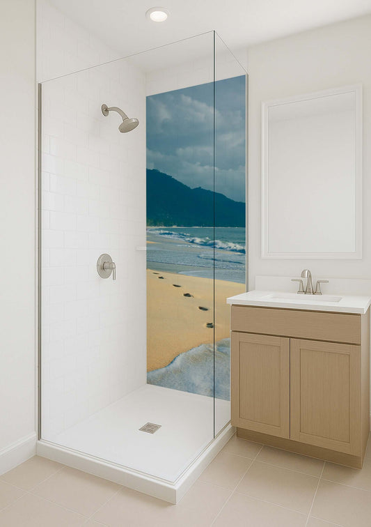 Stylish shower featuring a beach mural with footprints and mountains, enhancing a modern bathroom's aesthetic.