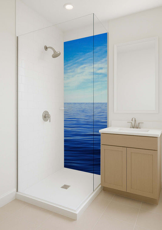 Serene bathroom shower with dark blue sea panel and white clouds, offering a calming atmosphere.