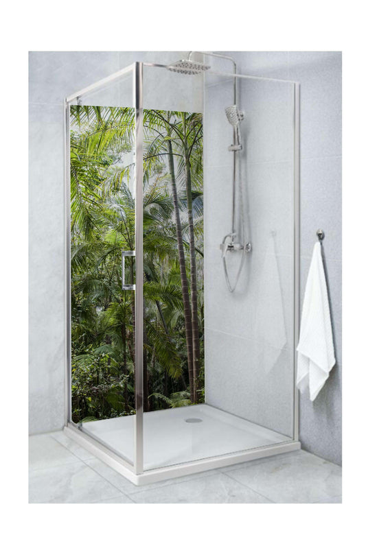 Glass shower with rainforest view, creating a nature-inspired escape in the bathroom.