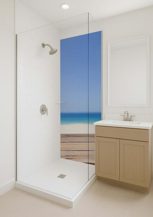 Modern bathroom featuring a glass shower with an ocean view graphic, light cabinetry, and bright ambiance.