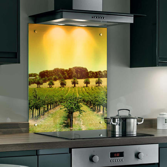 Vineyard landscape splashback in kitchen, featuring golden sky and lush vines for a rustic charm.